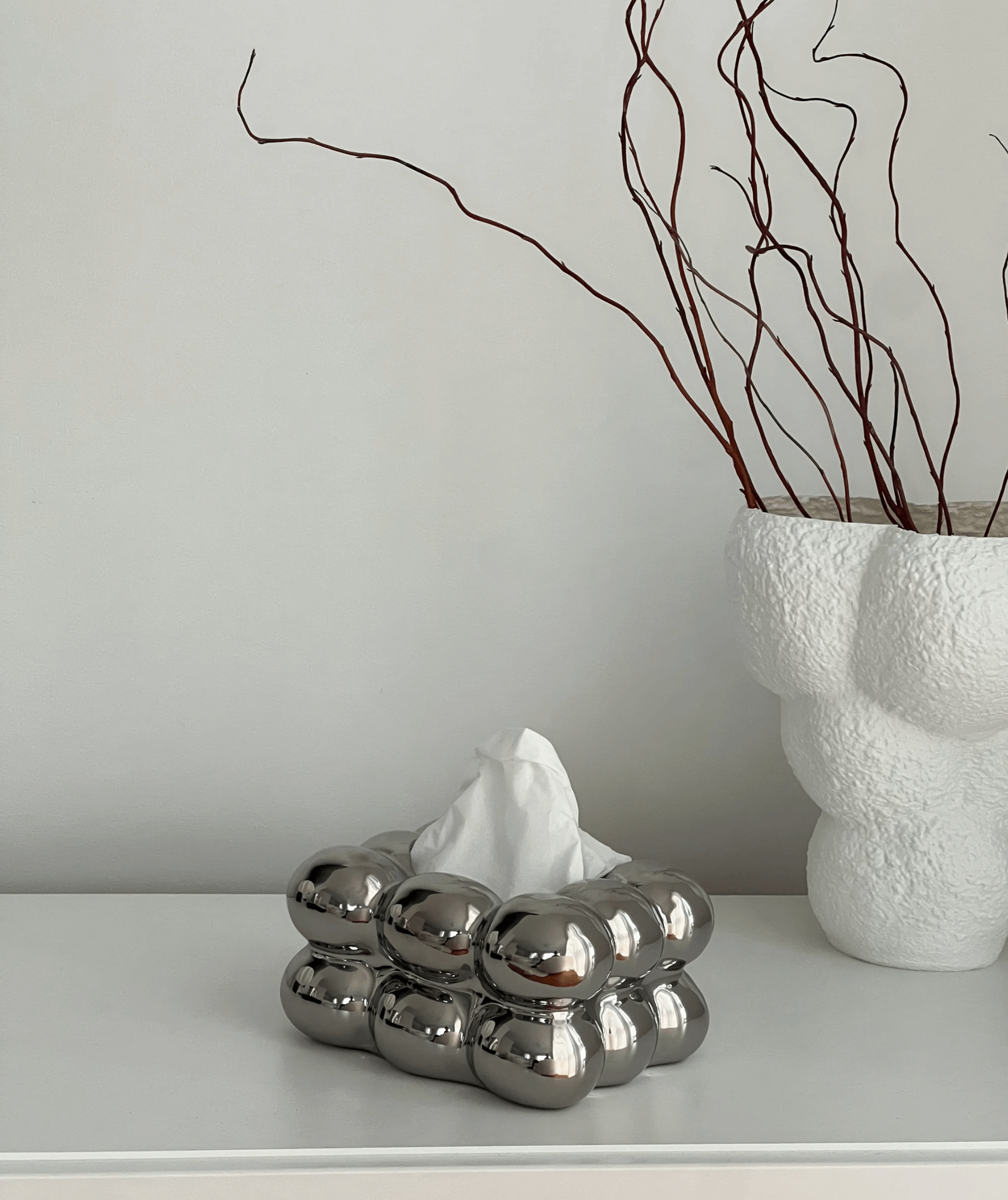 Modern ceramic bubble tissue box with luxury design on a white surface.
